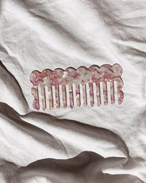 beautiful large acetate hair comb in lavender, pearl and tan tones featured in a flat lay in natural light 