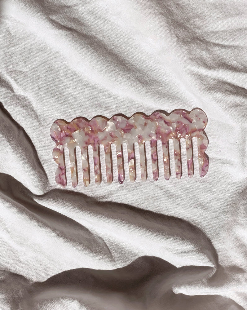 
            
                Load image into Gallery viewer, beautiful large acetate hair comb in lavender, pearl and tan tones featured in a flat lay in natural light 
            
        